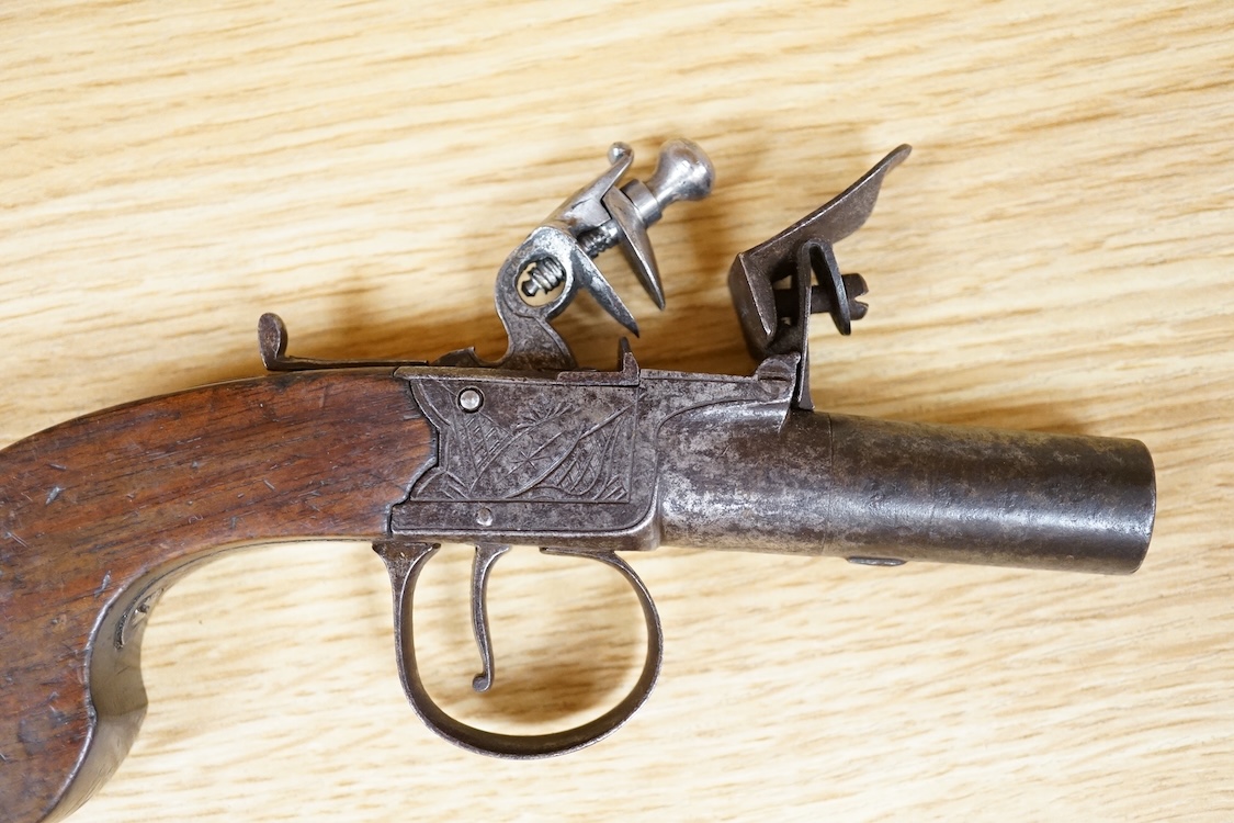 A boxlock flintlock pocket pistol with turn off barrel, Birmingham proved, frame engraved; Salmon and co., sliding safety catch